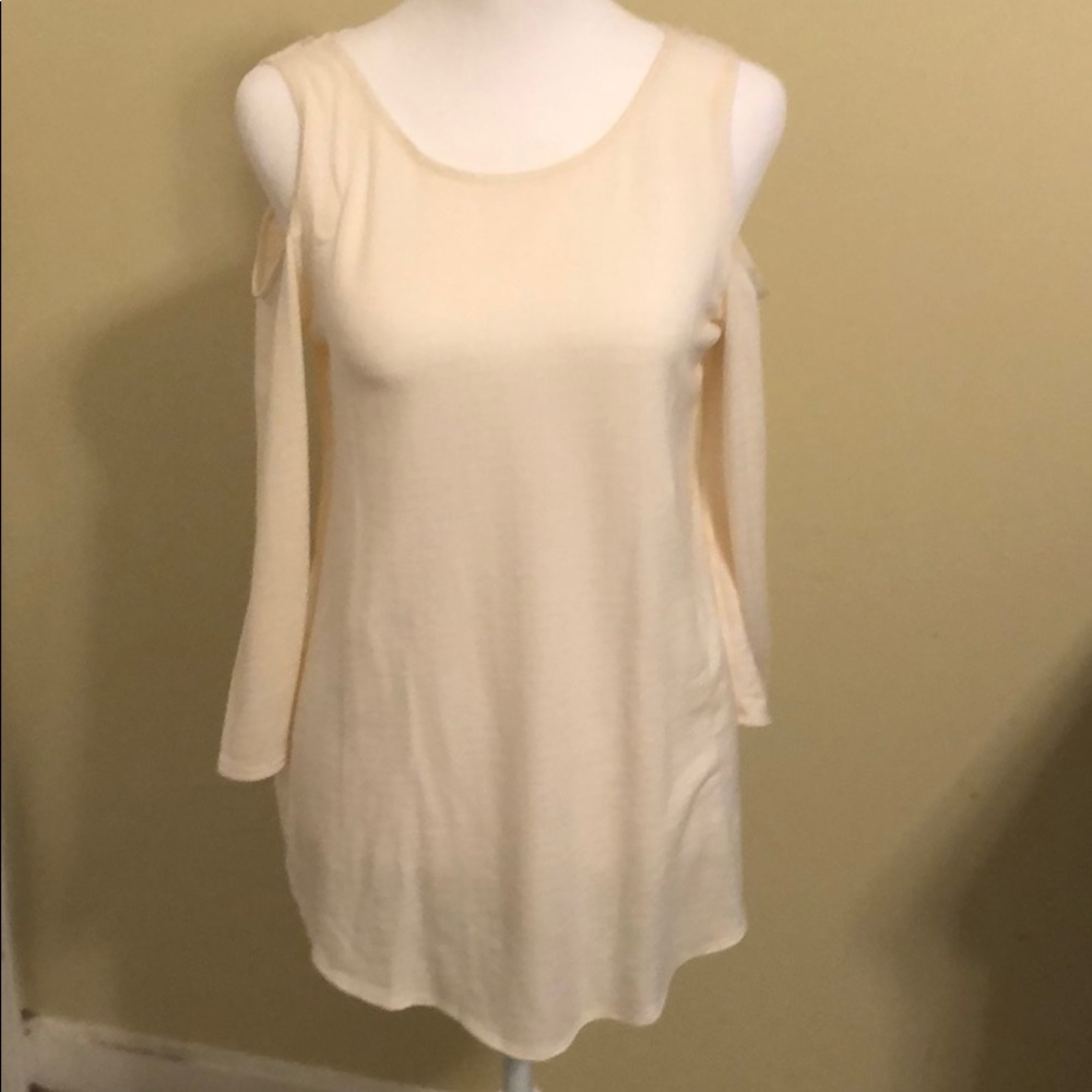 Status ..cream colored off the shoulder shirt